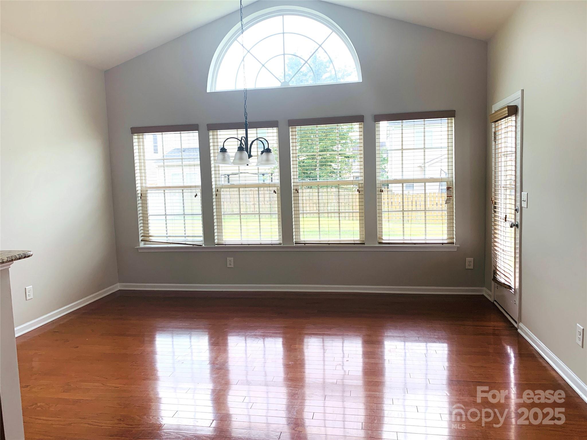 1472 Chandler Avenue Northwest Concord, NC 28027 - Photo 20 of 21 a view of empty room with wooden floor and fan