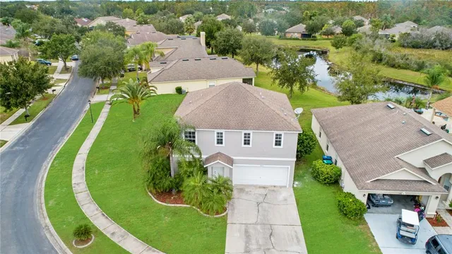 an aerial view of a house with a garden