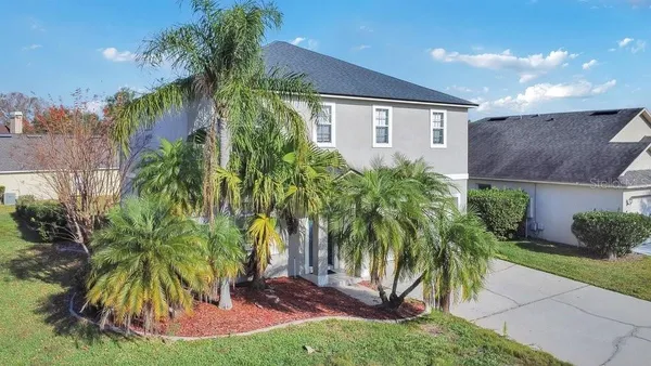 an aerial view of house with yard swimming pool and outdoor seating