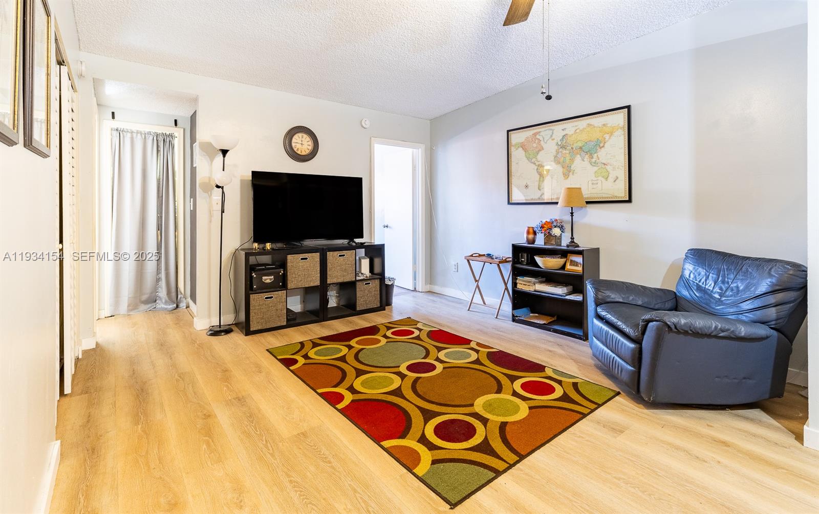 6491 Northwest 190th Terrace Hialeah, FL 33015 - Photo 15 of 28 a living room with furniture and a flat screen tv