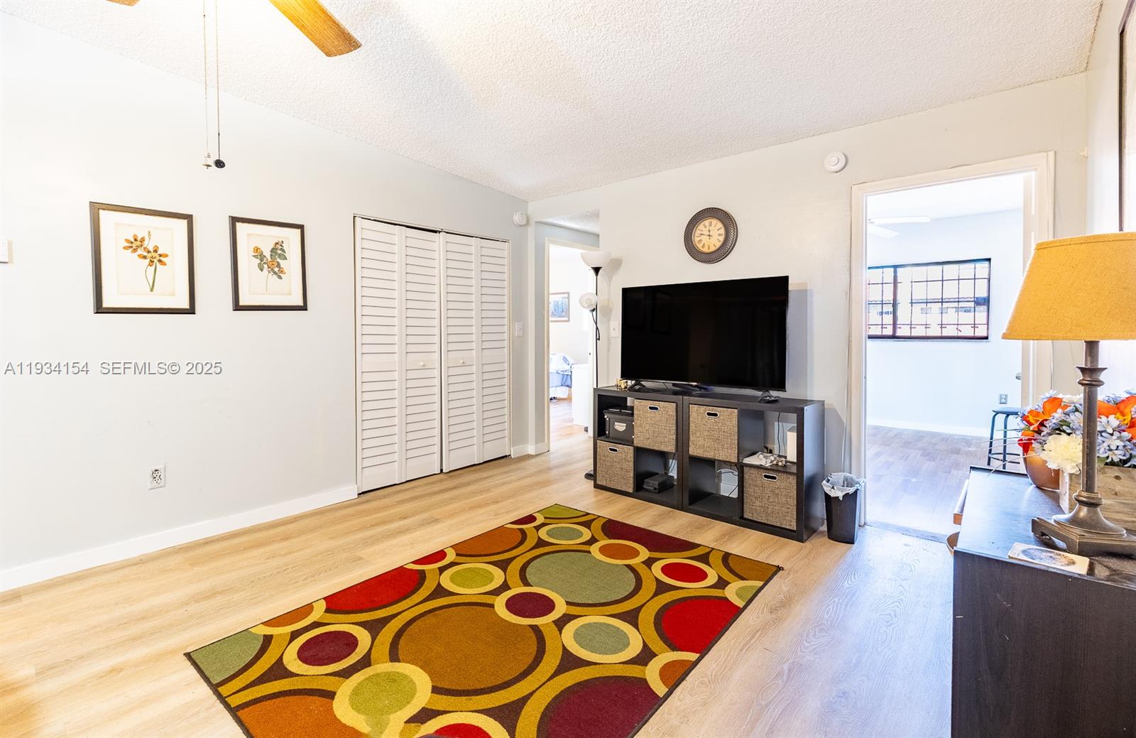 6491 Northwest 190th Terrace Hialeah, FL 33015 - Photo 16 of 28 a living room with furniture and a flat screen tv