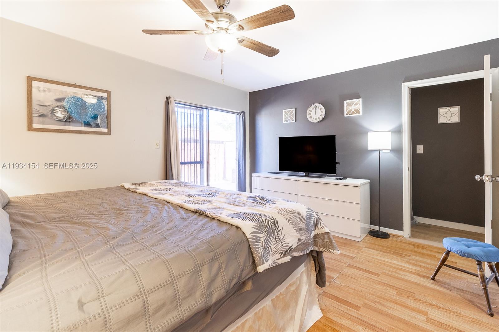 6491 Northwest 190th Terrace Hialeah, FL 33015 - Photo 20 of 28 a bedroom with a bed and a flat screen tv