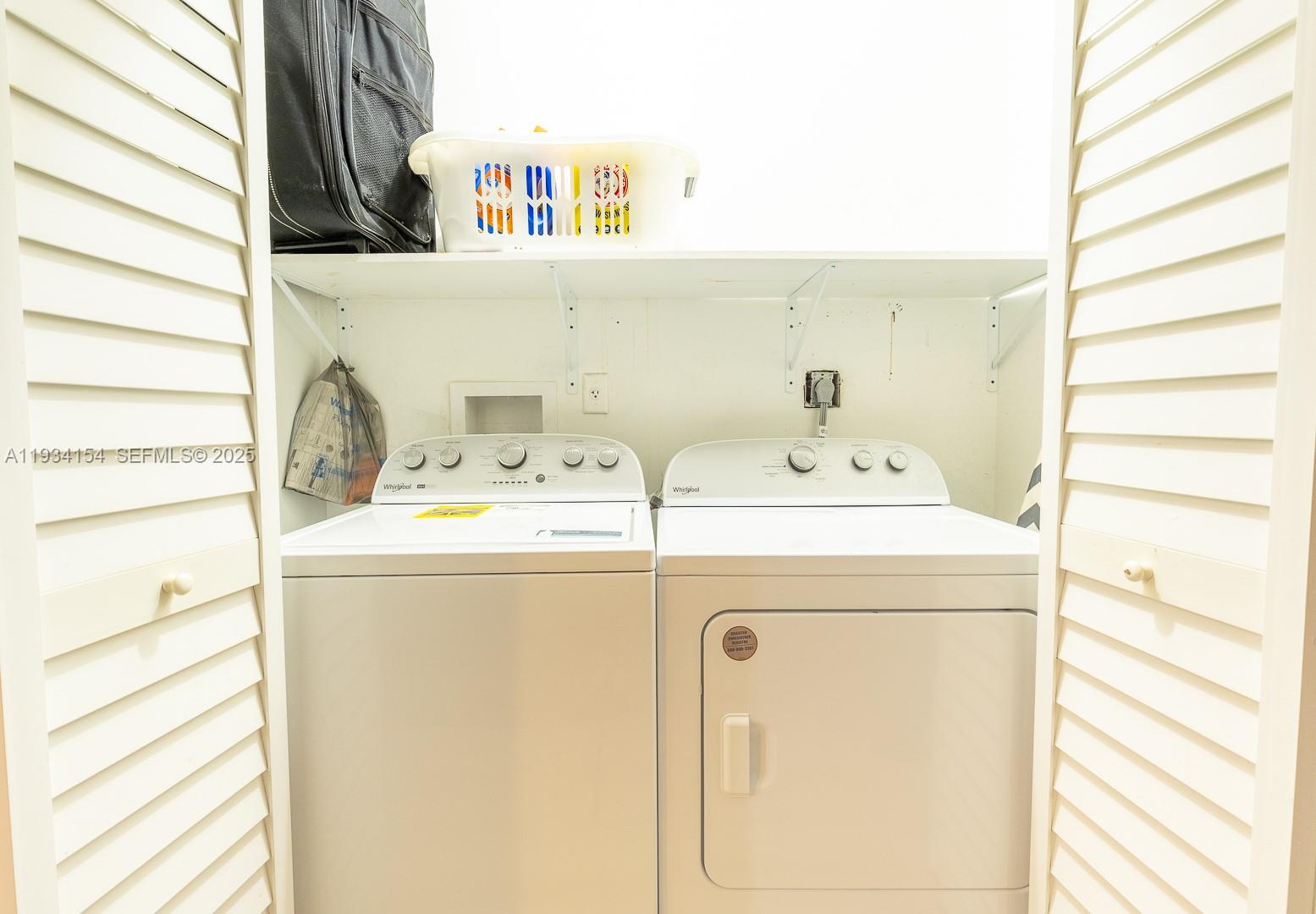 6491 Northwest 190th Terrace Hialeah, FL 33015 - Photo 25 of 28 a utility room with dryer and washer