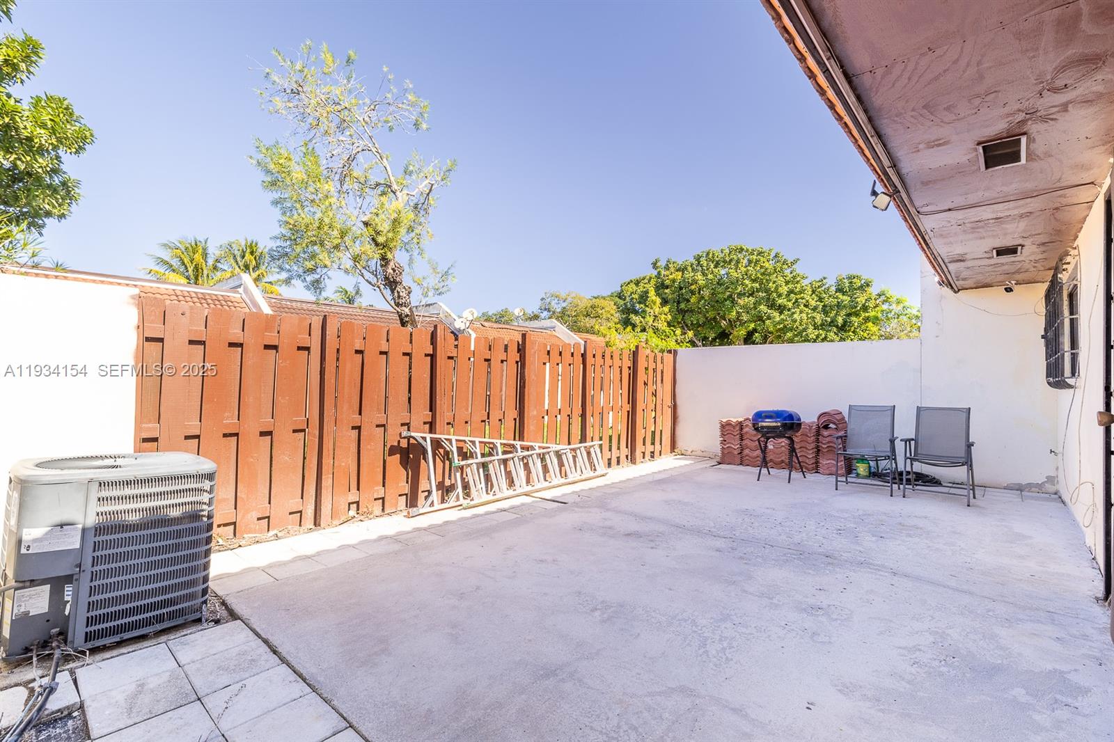 6491 Northwest 190th Terrace Hialeah, FL 33015 - Photo 26 of 28 a view of a chairs with a small yard