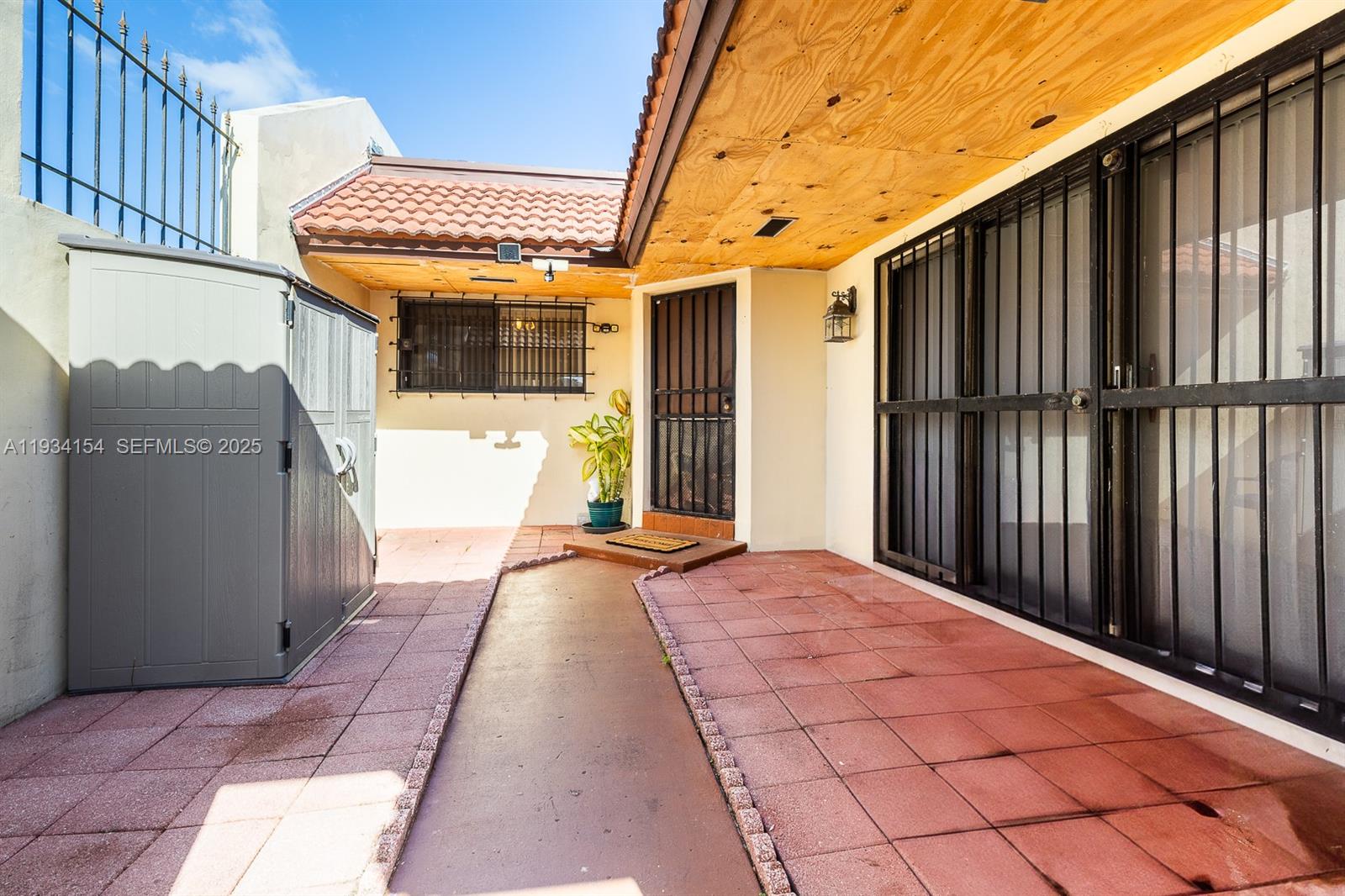 6491 Northwest 190th Terrace Hialeah, FL 33015 - Photo 6 of 28 a view of a house with a backyard