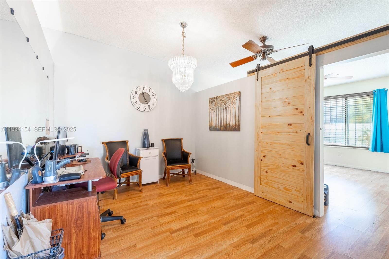 6491 Northwest 190th Terrace Hialeah, FL 33015 - Photo 7 of 28 a view of a workspace with wooden floor