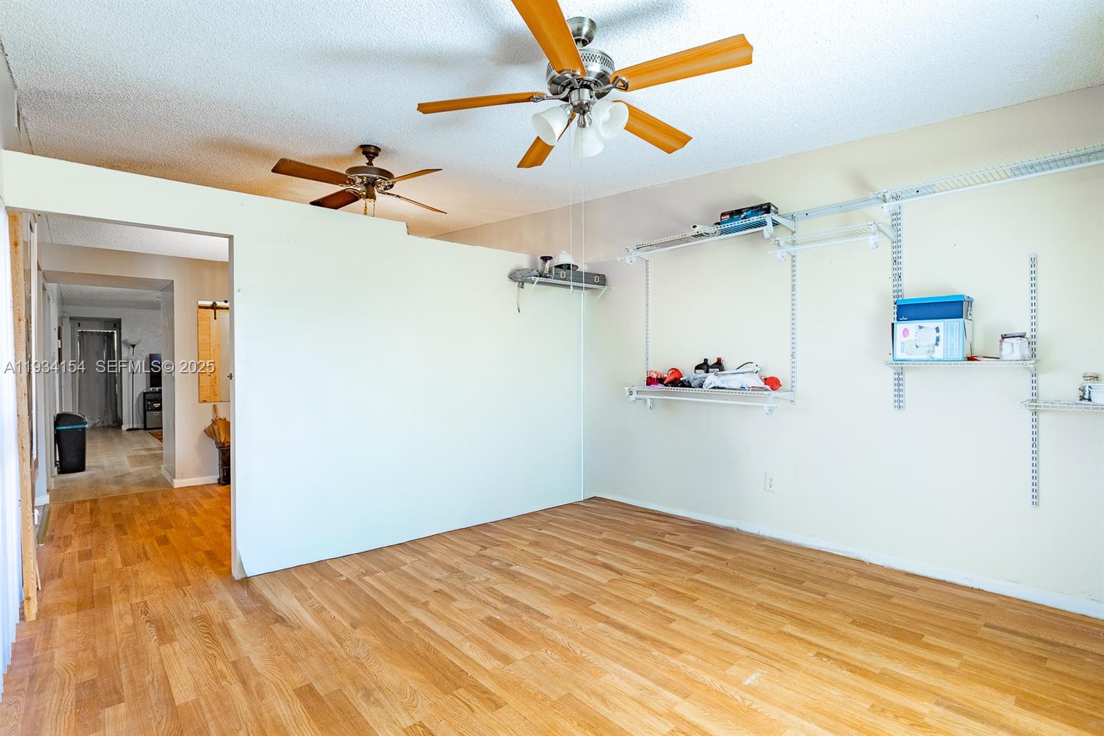 6491 Northwest 190th Terrace Hialeah, FL 33015 - Photo 10 of 28 a view of empty room with wooden floor