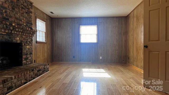 a view of livingroom with hardwood floor and a flat screen tv
