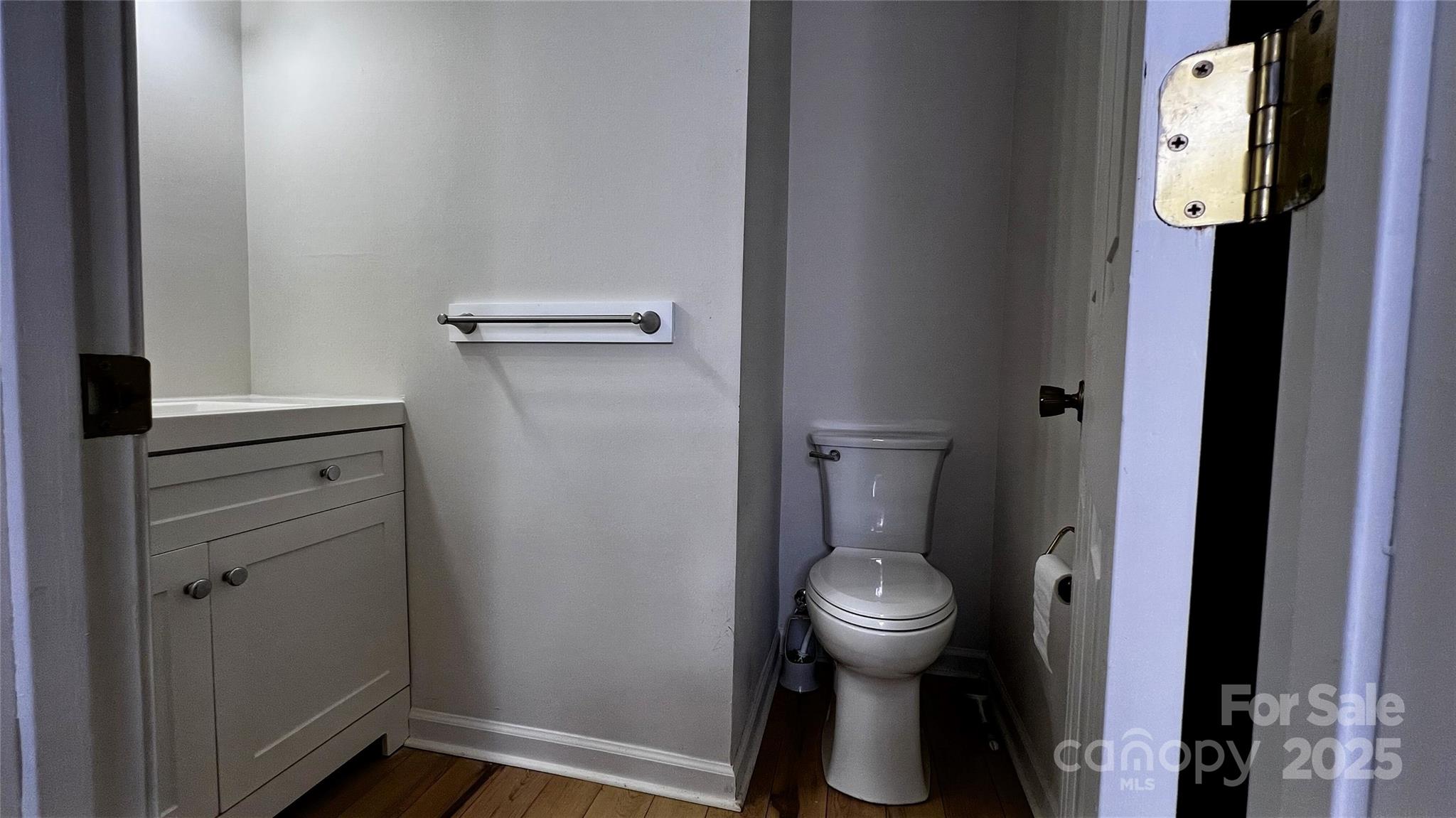 1325 Leolillie Lane Charlotte, NC 28216 - Photo 18 of 35 a bathroom with a toilet and a sink