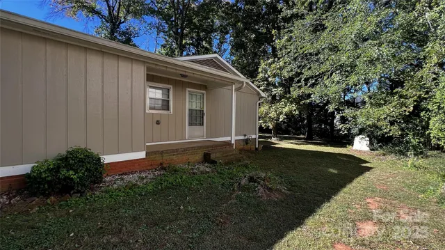 a view of swimming pool with a yard