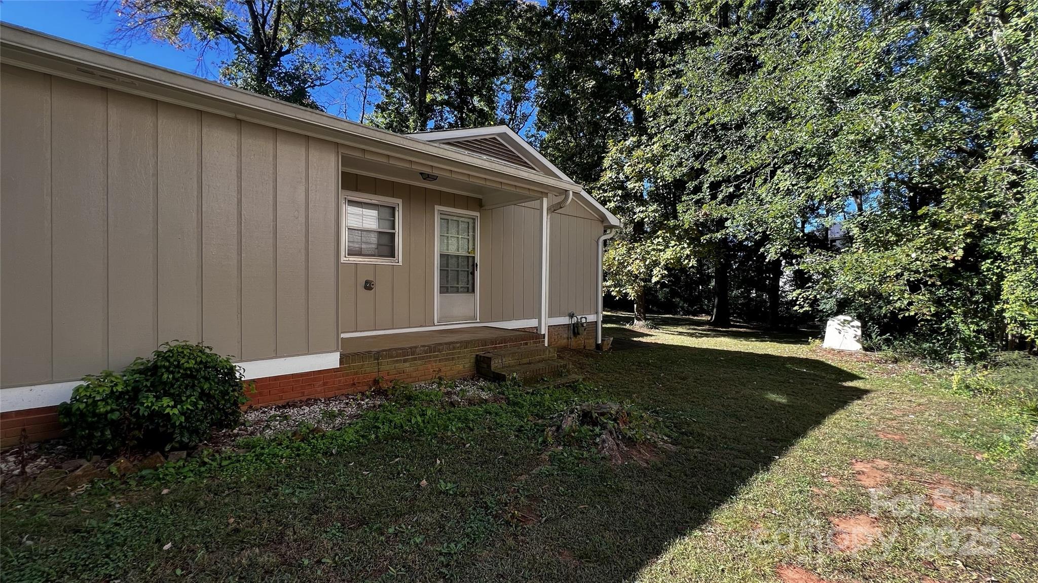 1325 Leolillie Lane Charlotte, NC 28216 - Photo 31 of 35 a view of a backyard with large trees