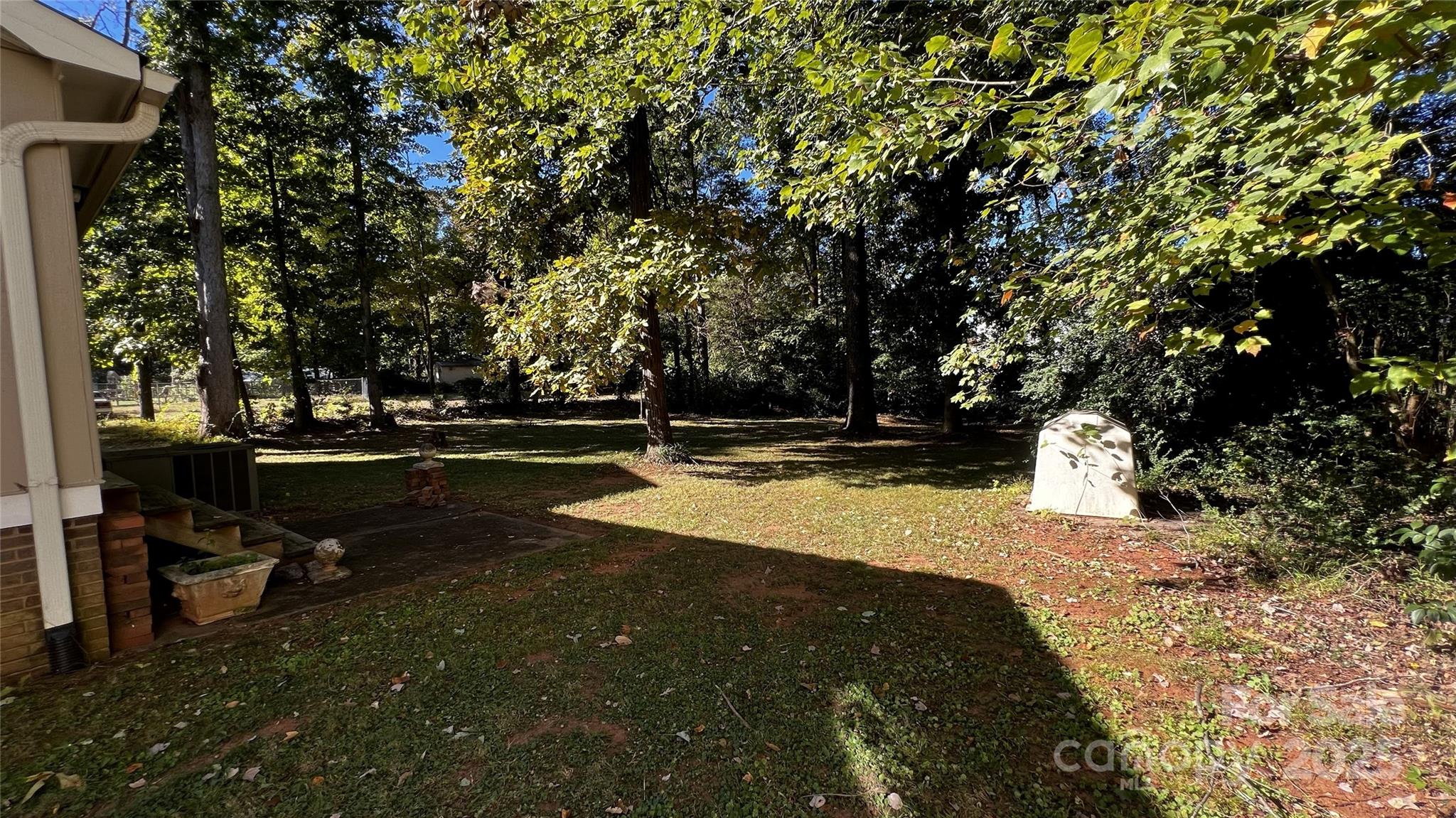 1325 Leolillie Lane Charlotte, NC 28216 - Photo 32 of 35 a view of yard with swimming pool and trees