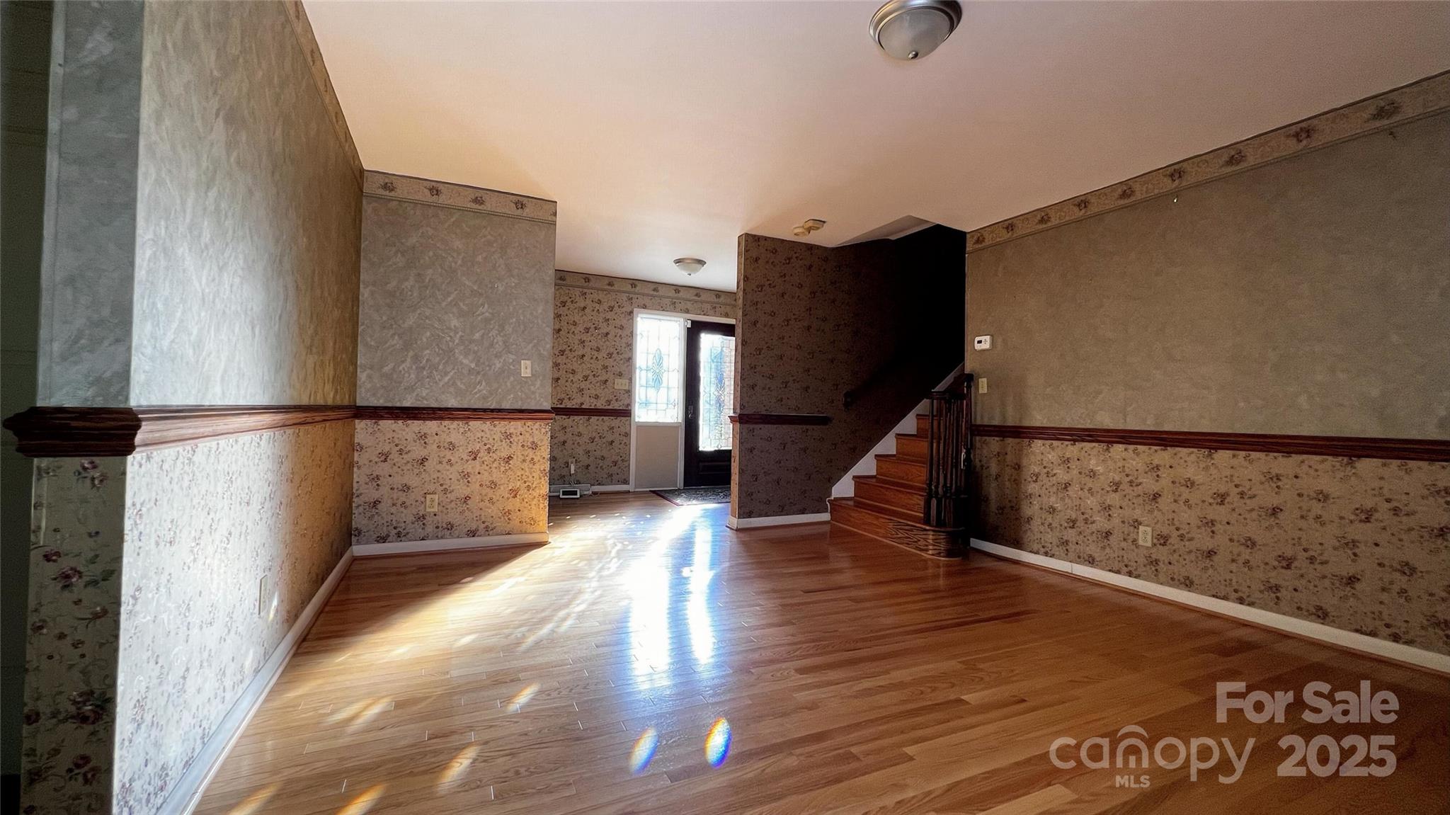 1325 Leolillie Lane Charlotte, NC 28216 - Photo 7 of 35 a view of entryway with wooden floor
