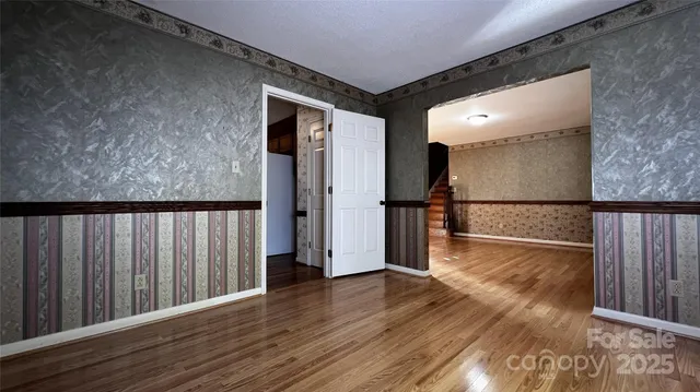 a kitchen with stainless steel appliances granite countertop a stove a sink dishwasher and a refrigerator