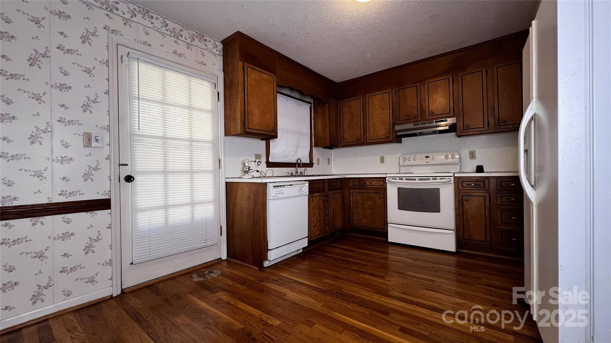 1325 Leolillie Lane Charlotte, NC 28216 - Photo 10 of 35 a kitchen with stainless steel appliances granite countertop a stove a sink dishwasher and a refrigerator