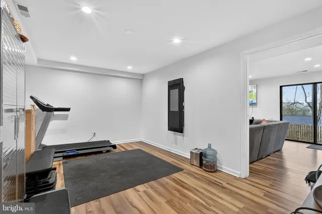 a view of swimming pool with wooden fence