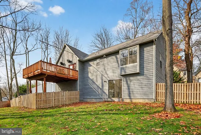 a view of a swimming pool with a yard