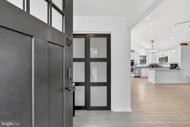 a view of storage and utility room with closet