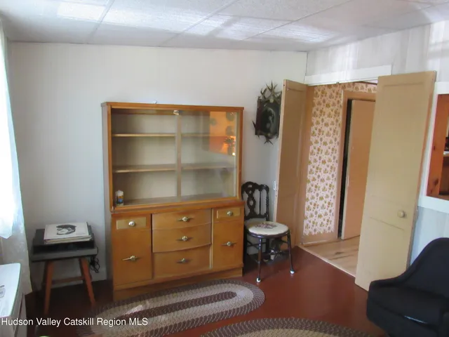 a living room with a furniture and a window