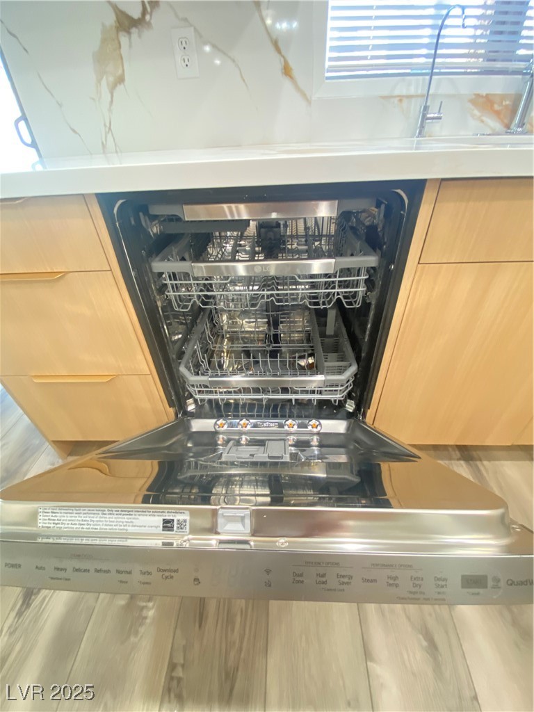 172 Tall Ruff Drive Las Vegas, NV 89148 - Photo 19 of 94 Kitchen view of dishwasher and wood finished floors