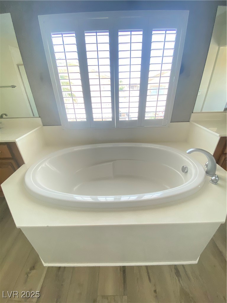 172 Tall Ruff Drive Las Vegas, NV 89148 - Photo 35 of 94 Bathroom with a garden tub, vanity, and healthy amount of natural light