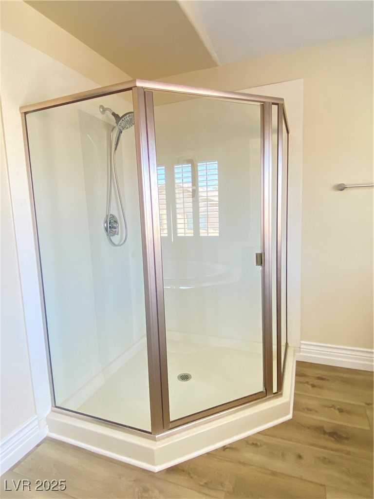 172 Tall Ruff Drive Las Vegas, NV 89148 - Photo 36 of 94 Full bathroom featuring wood finished floors, a shower stall, and baseboards