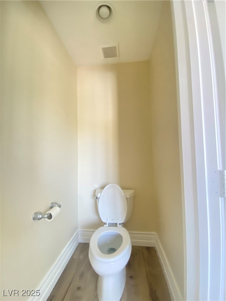 172 Tall Ruff Drive Las Vegas, NV 89148 - Photo 37 of 94 Bathroom with toilet, baseboards, and wood finished floors