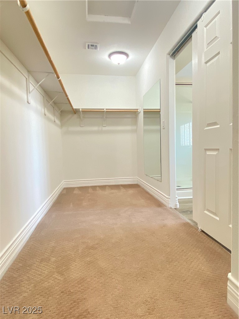 172 Tall Ruff Drive Las Vegas, NV 89148 - Photo 38 of 94 Spacious walk-in closet with light colored carpet