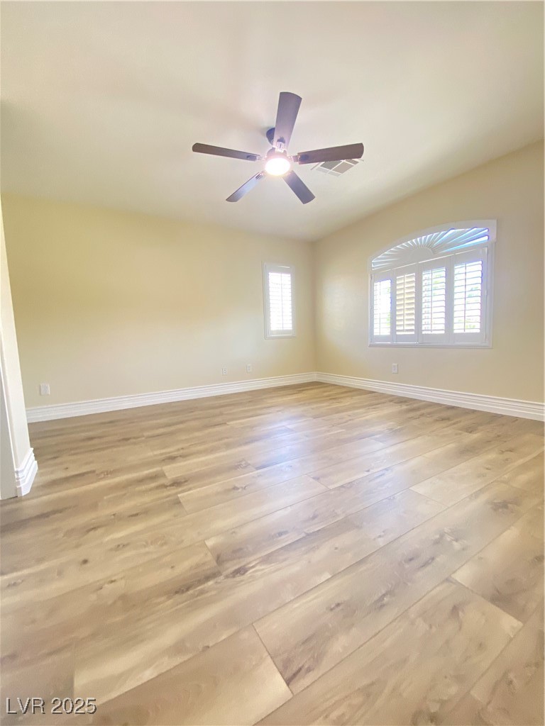172 Tall Ruff Drive Las Vegas, NV 89148 - Photo 43 of 94 3rd bedroom featuring baseboards, light wood-style flooring, and ceiling fan
