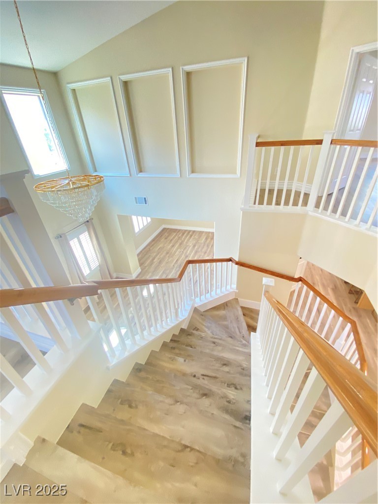 172 Tall Ruff Drive Las Vegas, NV 89148 - Photo 45 of 94 Staircase with plenty of natural light, wood finished floors, and baseboards