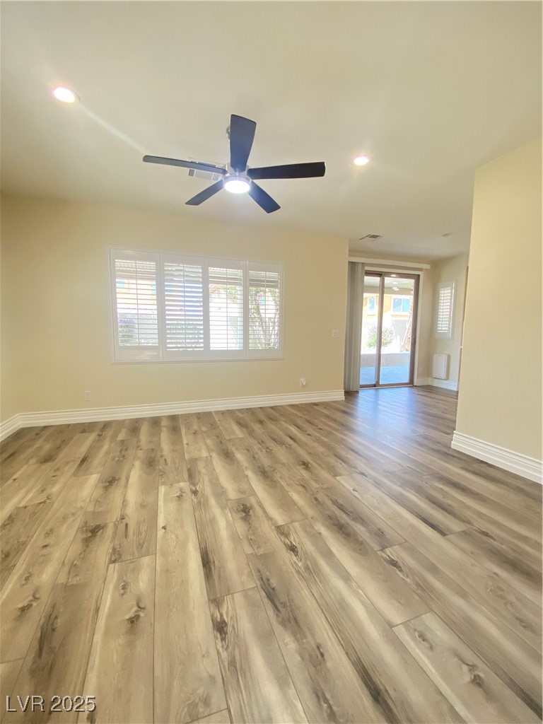 172 Tall Ruff Drive Las Vegas, NV 89148 - Photo 7 of 94 closer look from door entry featuring light wood-style flooring, baseboards, a ceiling fan, and recessed lighting