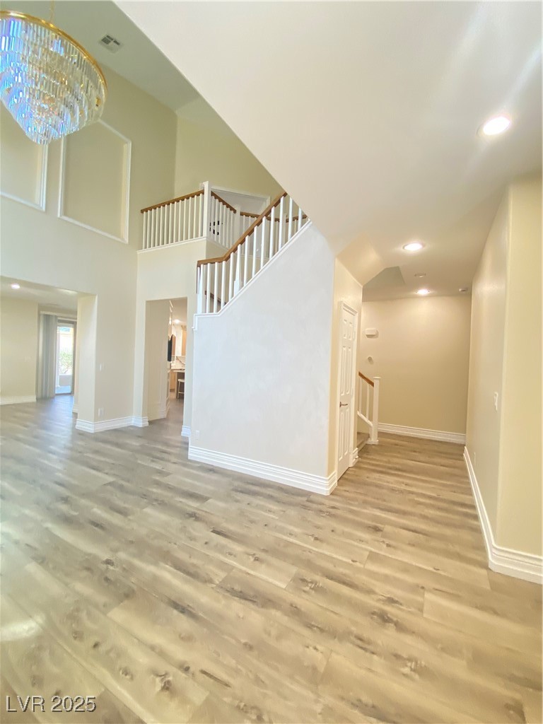 172 Tall Ruff Drive Las Vegas, NV 89148 - Photo 8 of 94 looking to the R from entry showing hidden staircase to upstairs