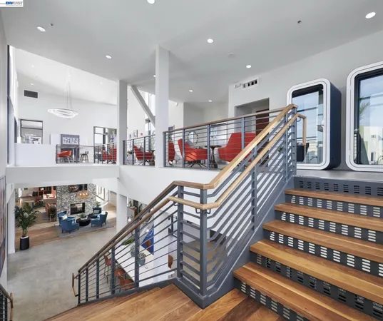 a view of kitchen with stainless steel appliances kitchen island granite countertop furniture and a microwave