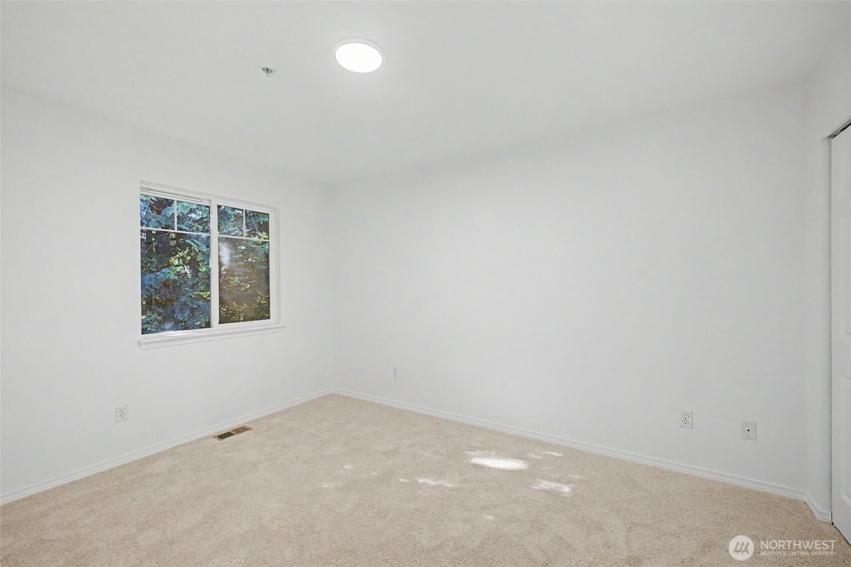 4124 214th Street Southwest, Unit C Mountlake Terrace, WA 98043 - Photo 12 of 20 an empty room with a window