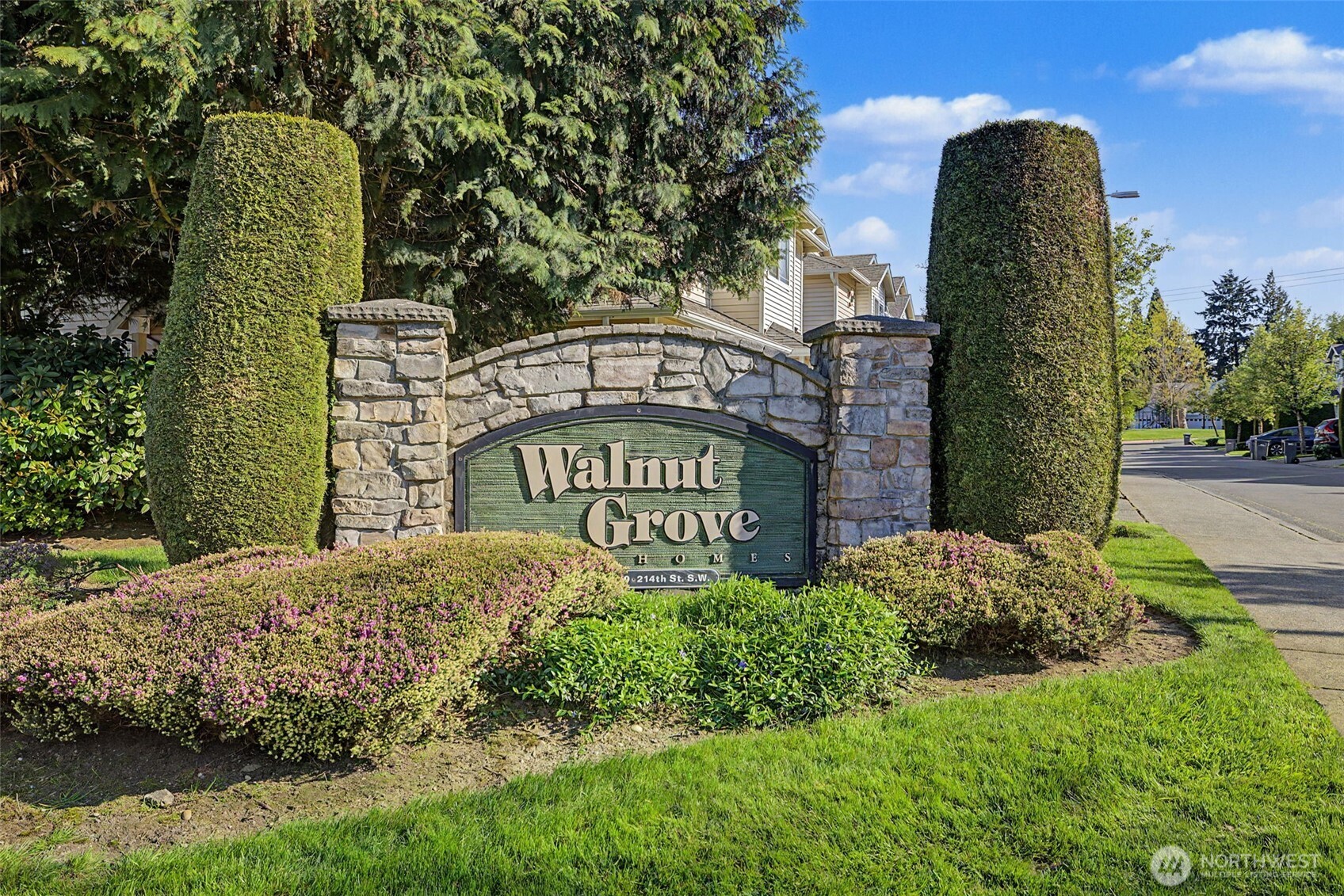 4124 214th Street Southwest, Unit C Mountlake Terrace, WA 98043 - Photo 19 of 20 a sign board with a building in the background