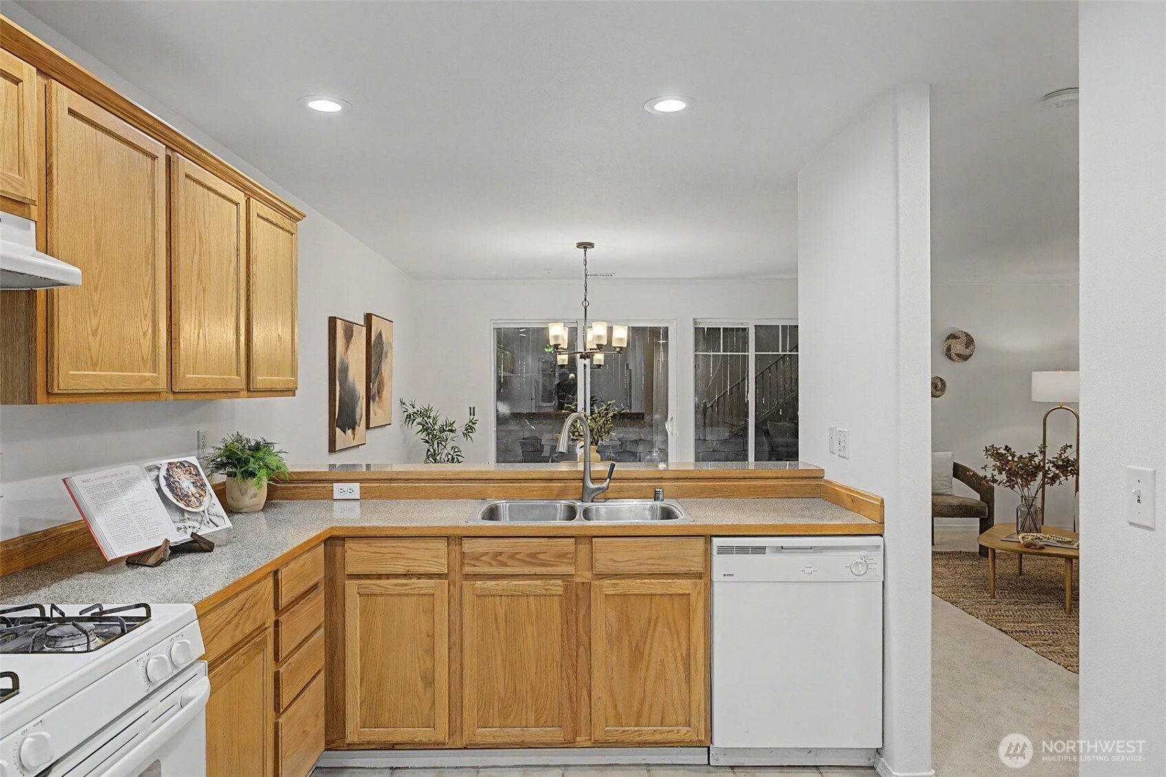 4124 214th Street Southwest, Unit C Mountlake Terrace, WA 98043 - Photo 6 of 20 a kitchen with stainless steel appliances granite countertop a sink stove and cabinets
