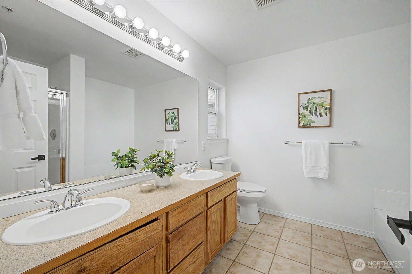 4124 214th Street Southwest, Unit C Mountlake Terrace, WA 98043 - Photo 9 of 20 a bathroom with a sink double vanity and a toilet