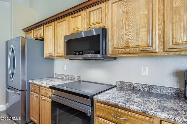 a bedroom with a bed a desk and chair