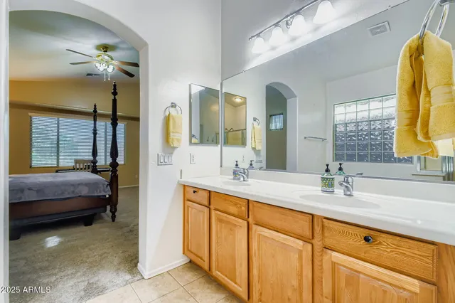 a bedroom with furniture and a window