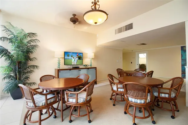a dining room with furniture and window
