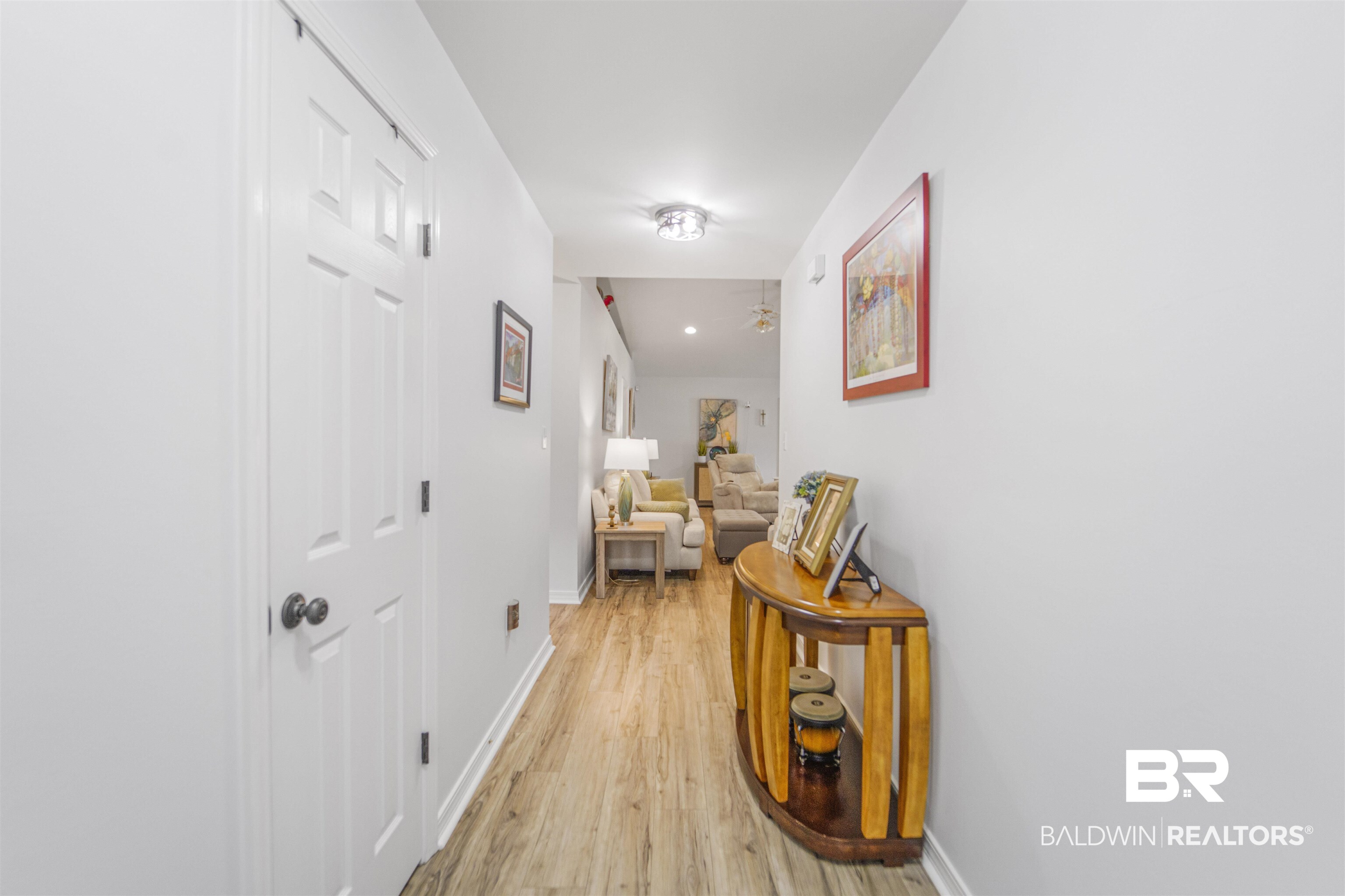 4620 Pine Boulevard Orange Beach, AL 36561 - Photo 14 of 49 Corridor featuring light wood-type flooring and baseboards