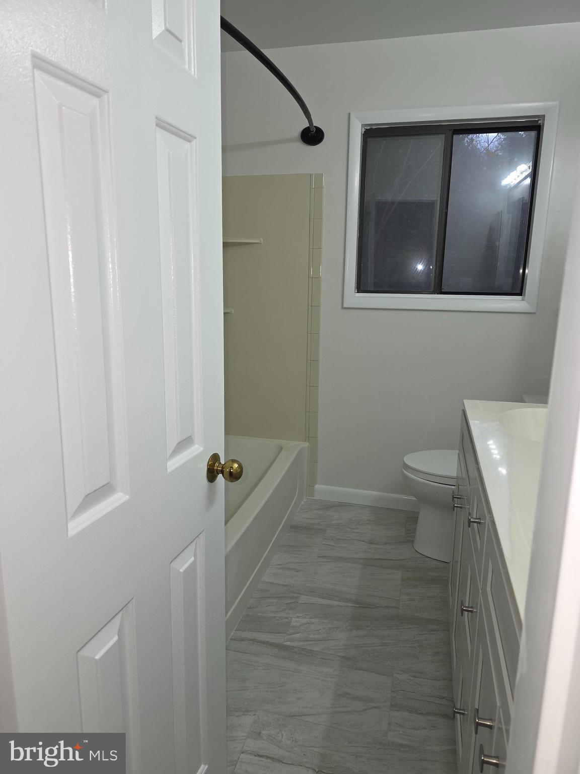 206 Skyhill Road, Unit 8 Alexandria, VA 22314 - Photo 14 of 16 a bathroom with a sink and mirror with toilet