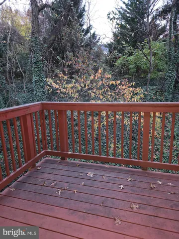a view of a room with wooden floor and chair