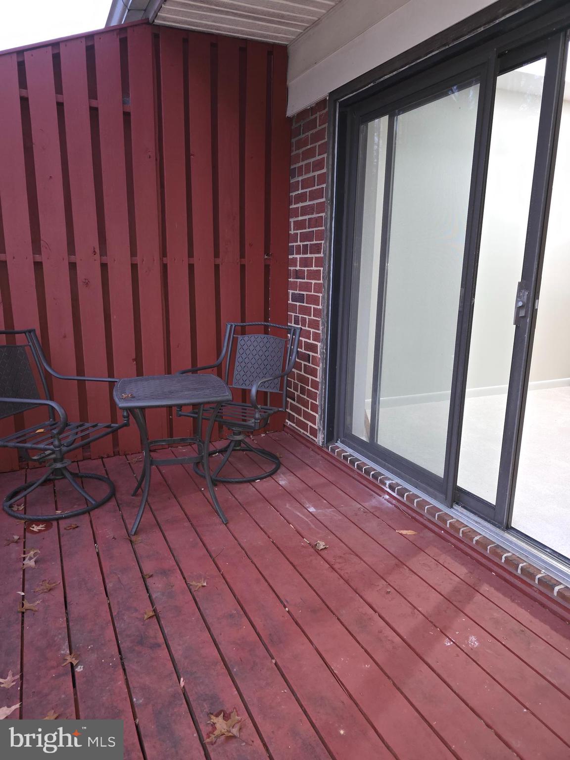 206 Skyhill Road, Unit 8 Alexandria, VA 22314 - Photo 16 of 16 a view of a room with wooden floor and chair