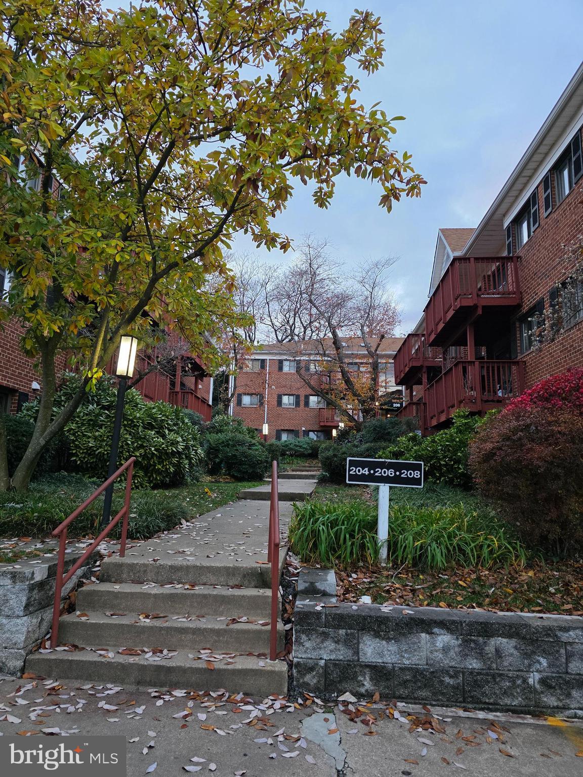 206 Skyhill Road, Unit 8 Alexandria, VA 22314 - Photo 2 of 16 a front view of a house with a yard