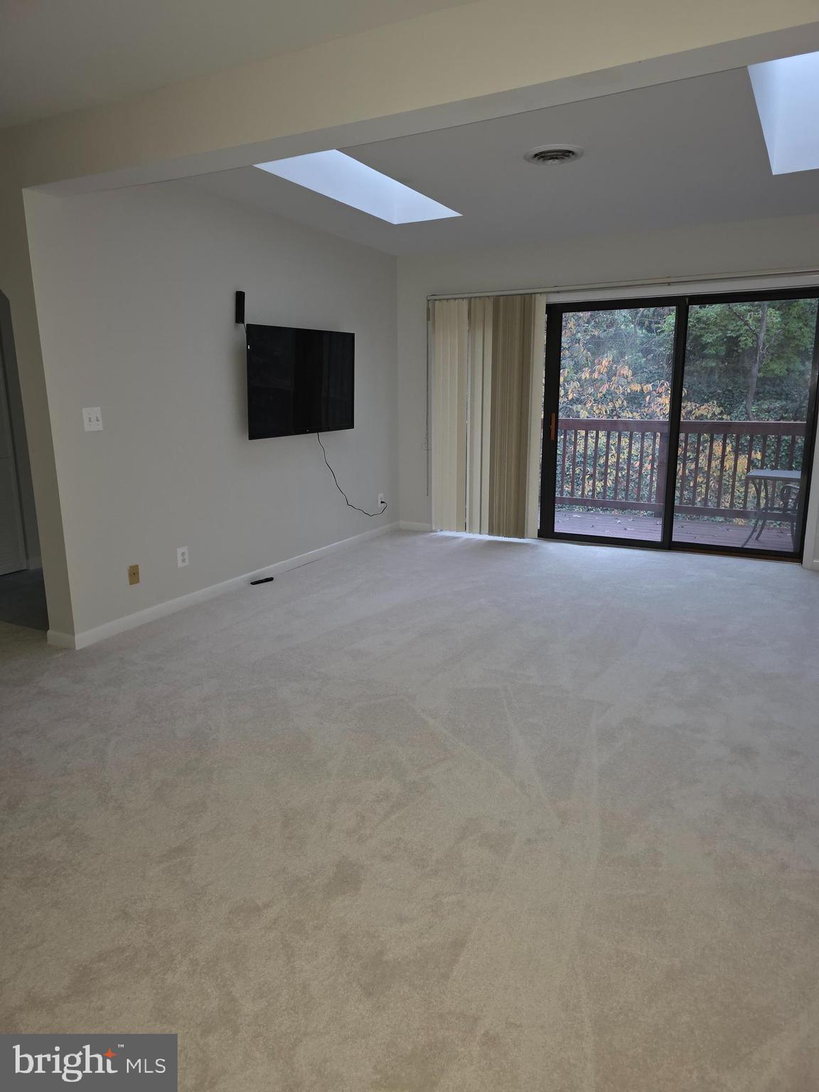 206 Skyhill Road, Unit 8 Alexandria, VA 22314 - Photo 5 of 16 a view of an empty room with a window