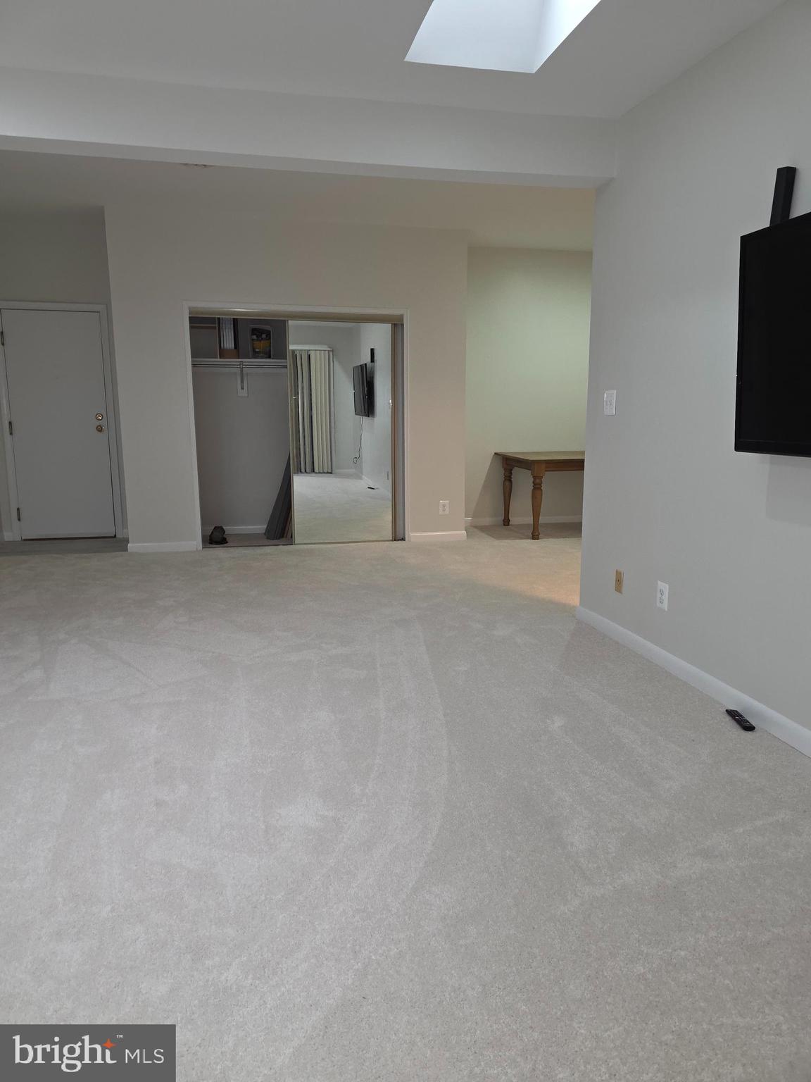 206 Skyhill Road, Unit 8 Alexandria, VA 22314 - Photo 7 of 16 a view of an empty room with a kitchen
