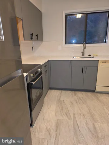 a bathroom with a sink vanity and mirror