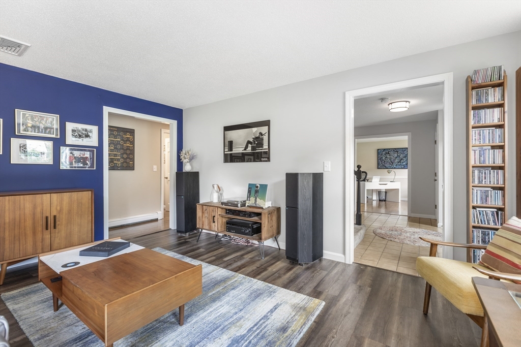 61 Sunset Drive Milford, MA 01757 - Photo 16 of 42 a living room with furniture rug and wooden floor