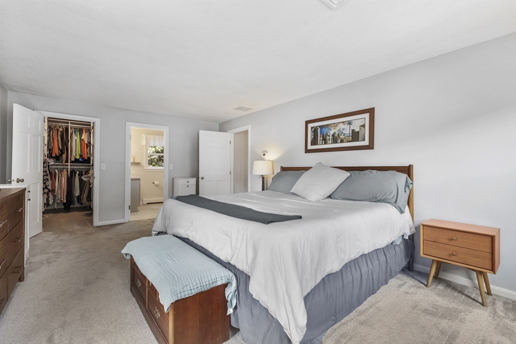 61 Sunset Drive Milford, MA 01757 - Photo 20 of 42 a bed room with a bed and a couch